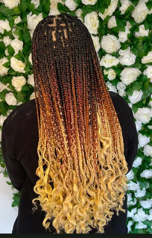 Medium knotless braids — salon work by Mariama